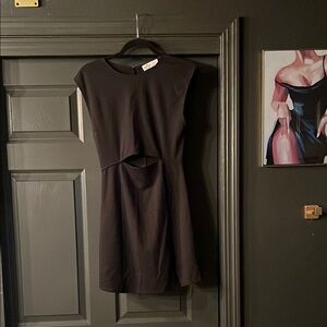 Sleek Black Cutout Mini Dress with Modern Design